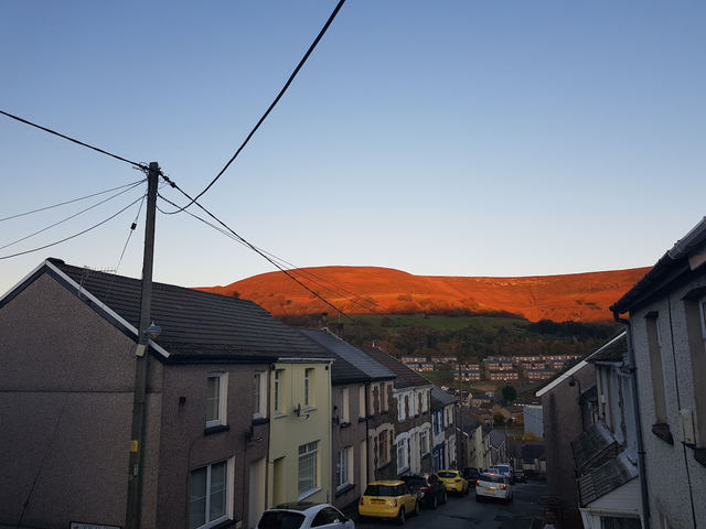 Gaen Street at sunset with the mountain lit orange behind